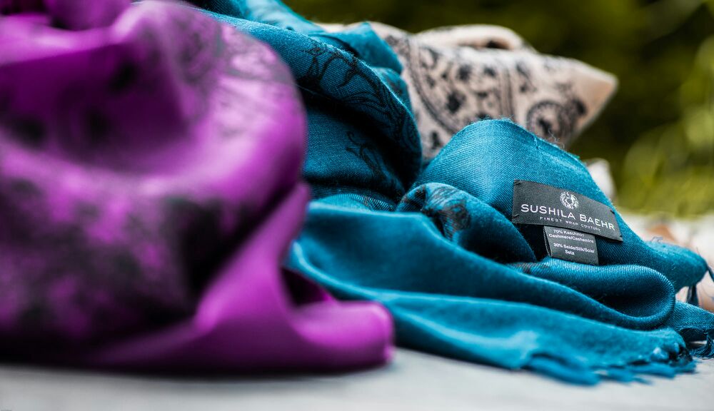 Sushila Baehr Scarves Lifestyle Shot of blue, taupe and purple Scarf